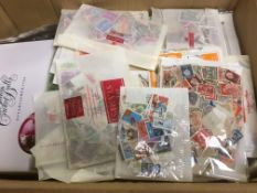 FOUR BOXES WITH VAST ACCUMULATION OF STAMPS IN ENVELOPES, BAGS,