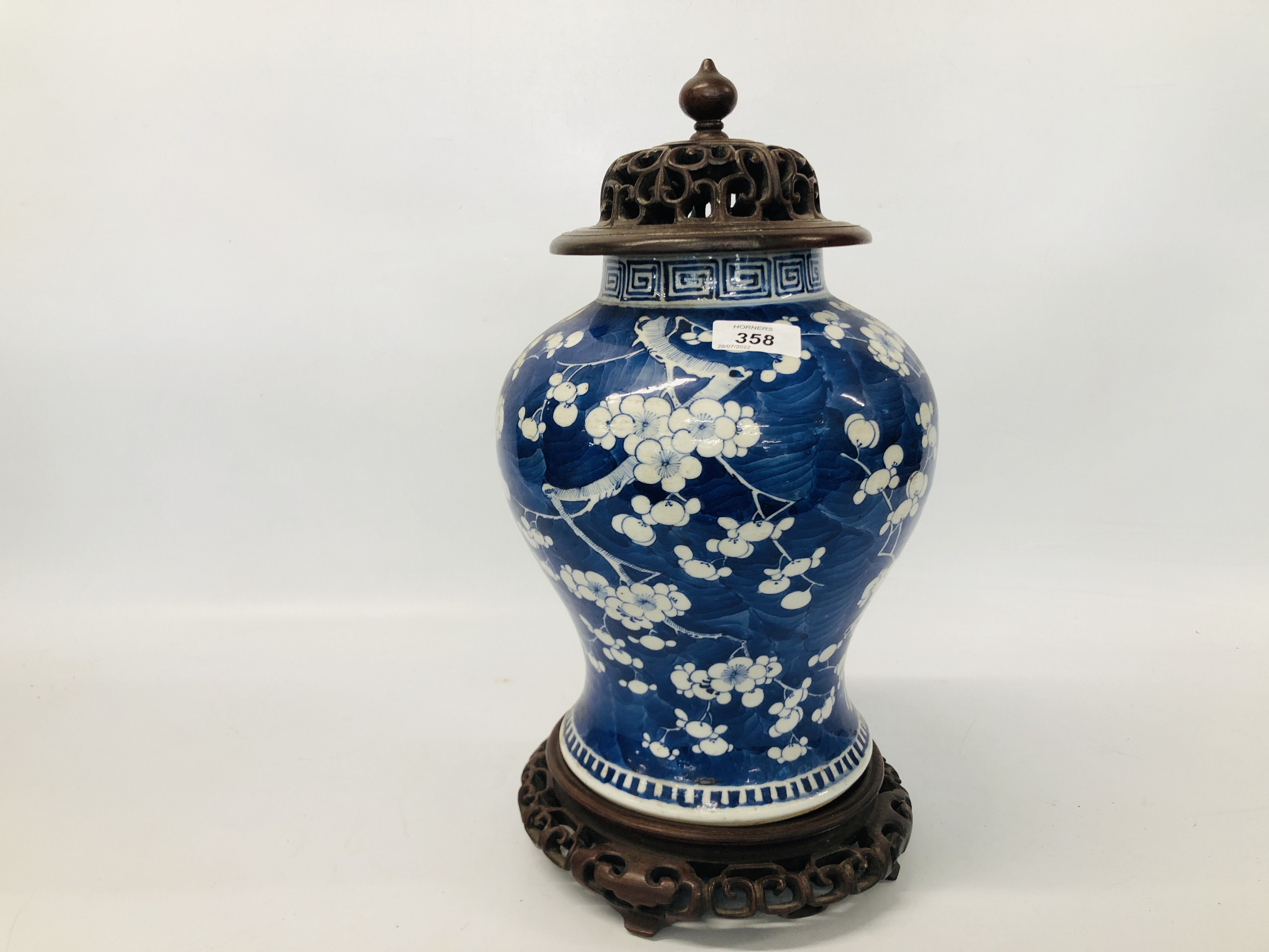 CHINESE BLUE AND WHITE BALUSTER SHAPED VASE WITH PRUNUS DECORATION (HEIGHT 27CM.