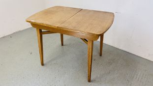 RETRO OAK FINISH BEAUTILI TEA TABLE WITH EXTENDING ACTION AND CONCEALED TEA TRAY.