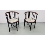 A PAIR OF EDWARDIAN TUB CHAIRS ON CROSS STRETCHER SUPPORT
