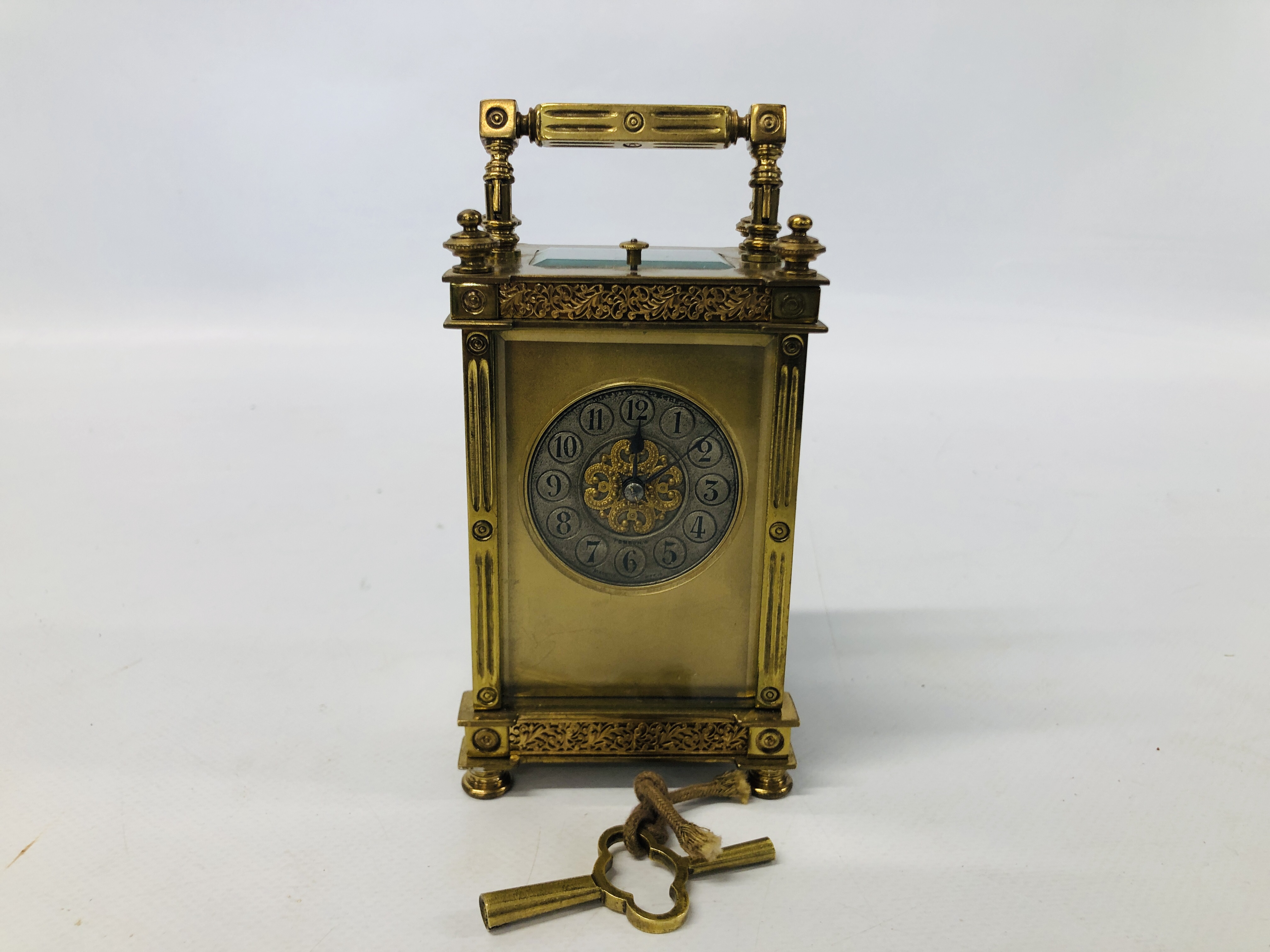 A FRENCH CARRIAGE CLOCK RETAILED BY MAPPIN & WEBB, THE SILVERED CHAPTER RING WITH ENGLISH NUMERALS,