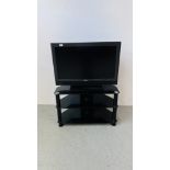 SONY BRAVIA 32 INCH TELEVISION MODEL KDL-3243000 ALONG WITH A MODERN BLACK GLASS THREE TIER STAND -