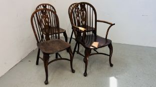 A GROUP OF FOUR STICK BACK ELM SEATED CHAIRS INCLUDING WINDSOR,