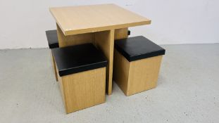 A MODERN OAK FINISH COMPACT DINING TABLE WITH FOUR HIDE-AWAY STOOLS