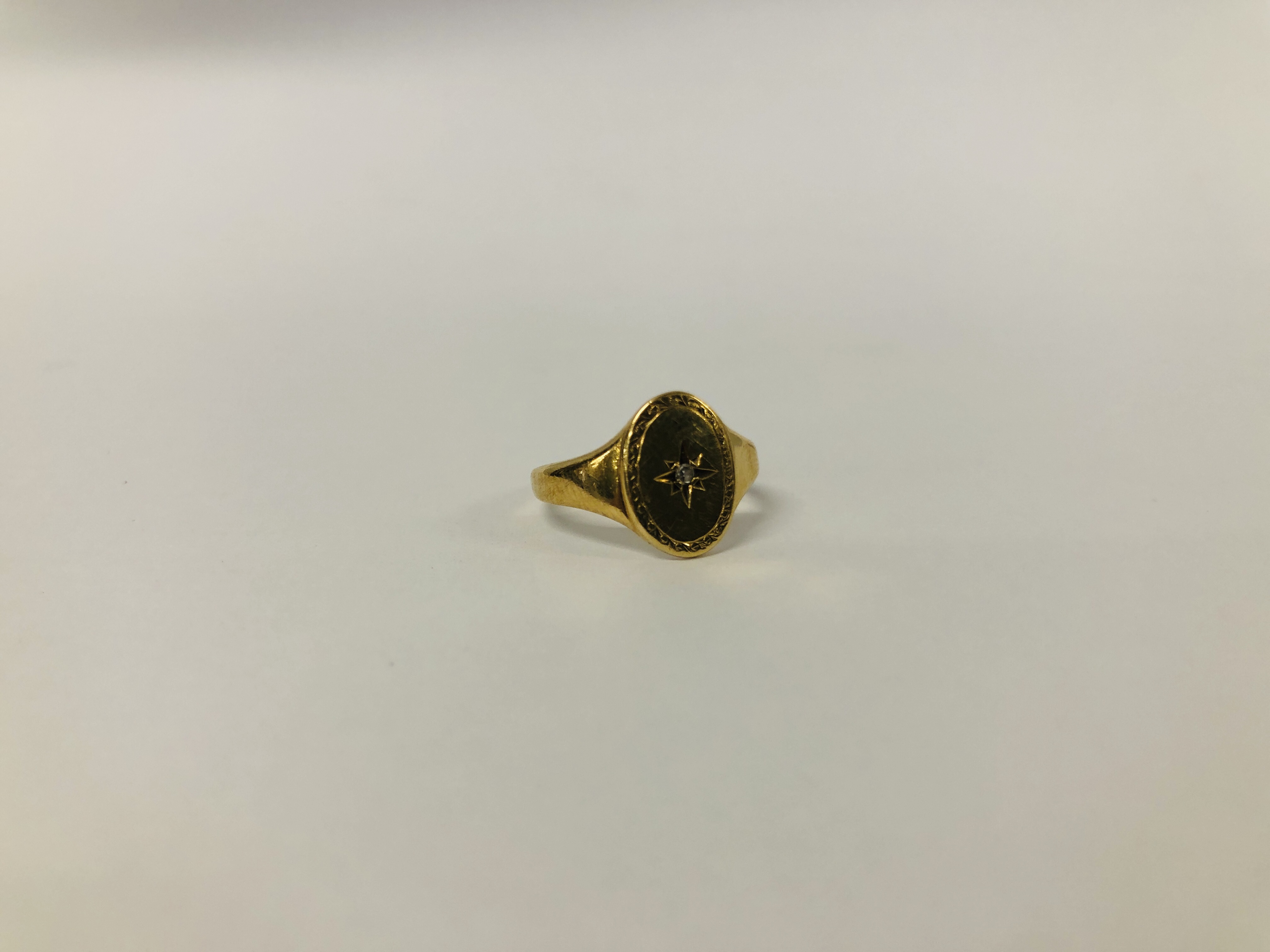 YELLOW METAL (RUBBED MARKS) DIAMOND SET SIGNET RING