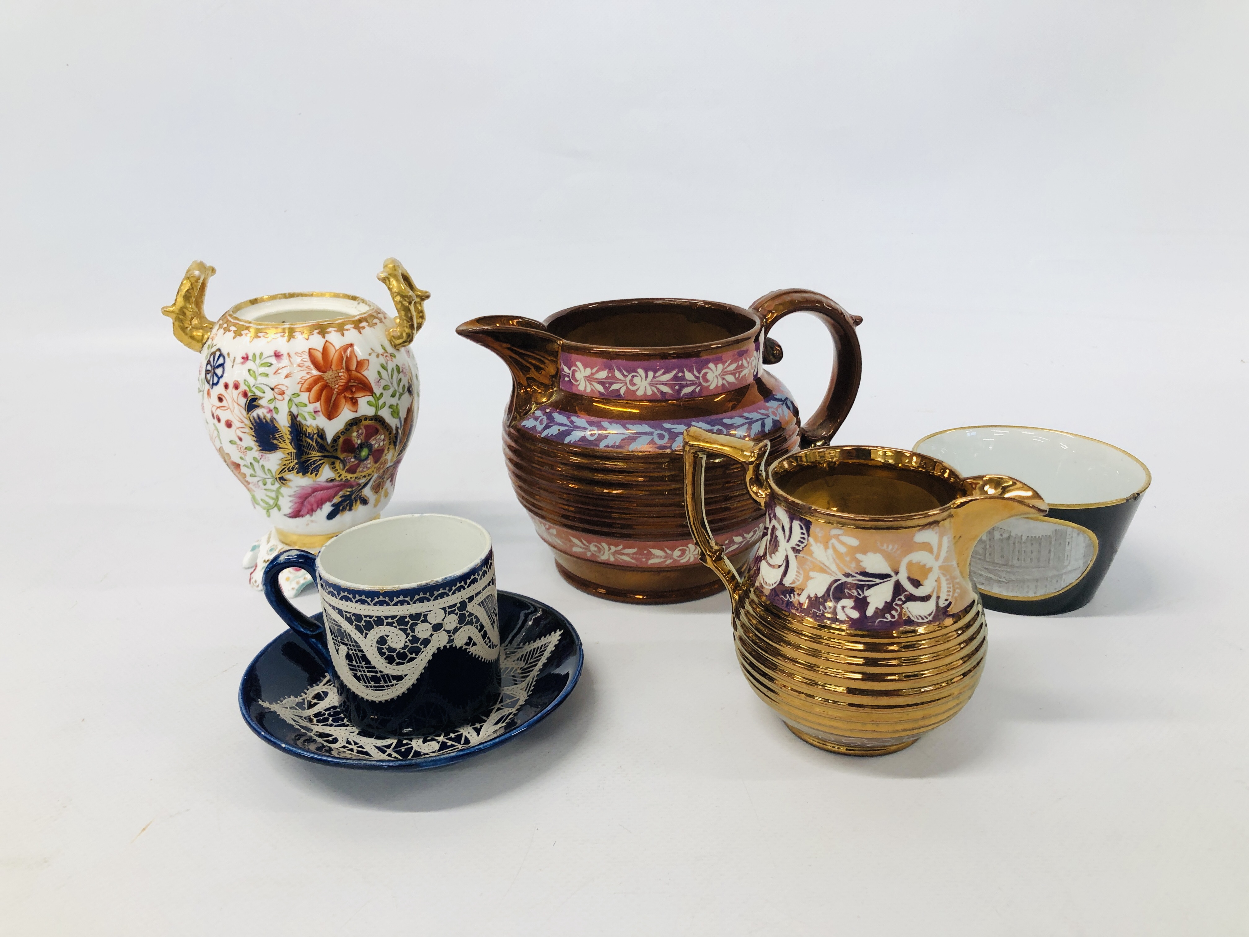 A LUSTRE WARE REEDED JUG AND A SIMILAR CREAM JUG HEIGHT 10.5CM. AND 8CM.