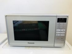 A PANASONIC MICROWAVE OVEN MODEL NN-EZ8JMM - SOLD AS SEEN.