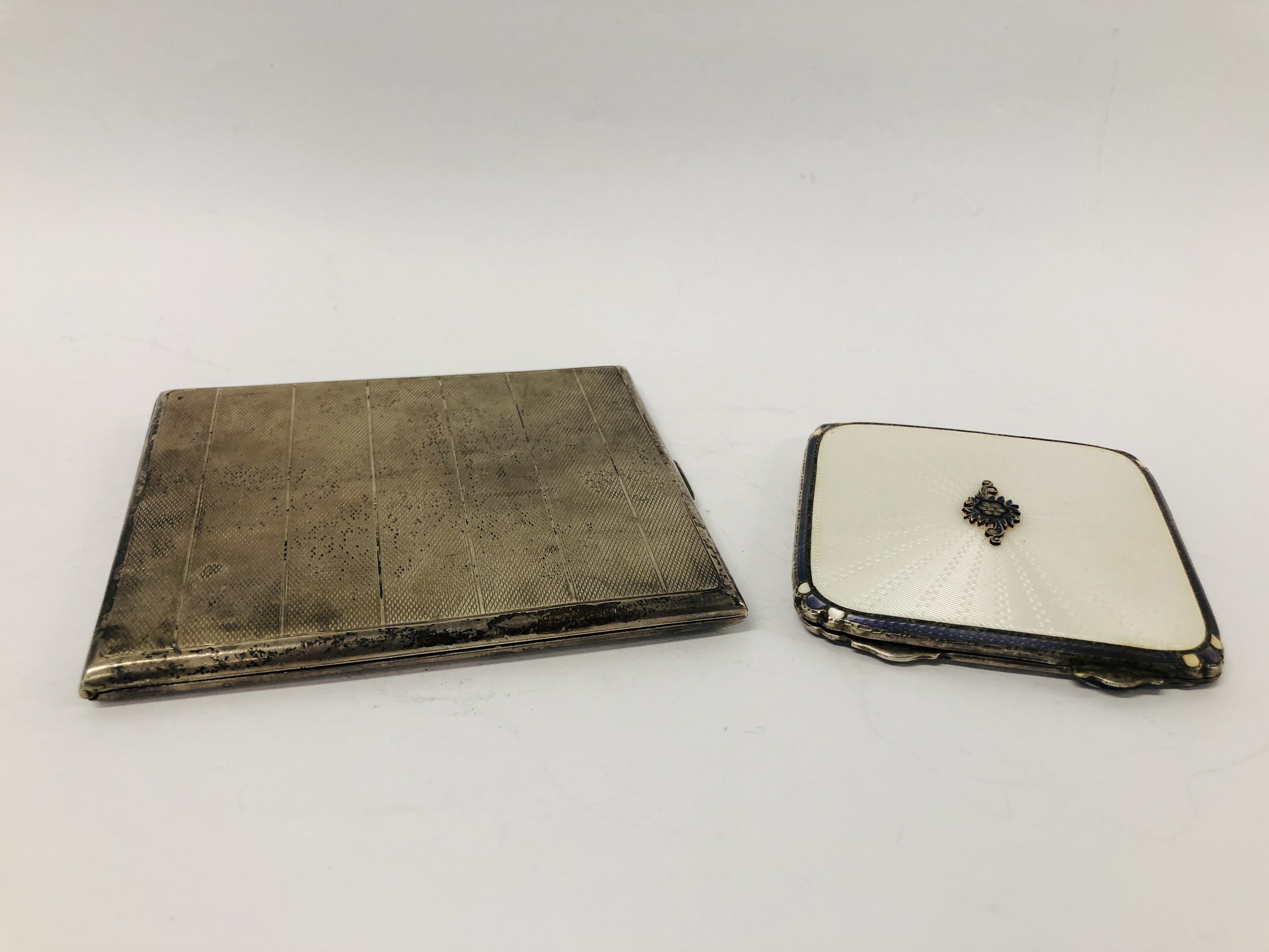 A SILVER AND WHITE ENAMEL COMPACT, BIRMINGHAM ASSAY, ALONG WITH A SILVER CIGARETTE CASE,