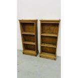 A PAIR OF MEXICAN PINE CORONA BOOK SHELVES WIDTH 46CM. DEPTH 20CM. HEIGHT 104CM.