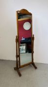 A HONEY PINE CHEVAL MIRROR WIDTH 60CM. HEIGHT 169CM.