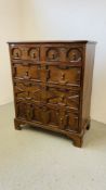 A JACOBEAN STYLE GEOMETRICAL OAK TWO OVER THREE CHEST OF DRAWERS W 103CM, D 53CM, H 123CM.