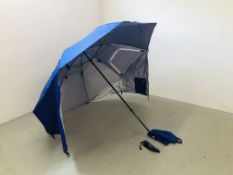 AN AS NEW BEACH FISHING UMBRELLA COMPLETE WITH PEGS