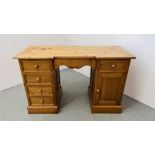 A WAXED SOLID PINE TWIN PEDESTAL DESK / DRESSING TABLE W 130CM, D 53CM, H 81CM.