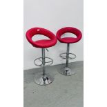 A PAIR OF RISE AND FALL RED FAUX LEATHER BAR STOOLS ON CHROME BASE