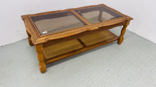 RECTANGULAR GLASS TOP COFFEE TABLE WITH RATTAN TIER BELOW,