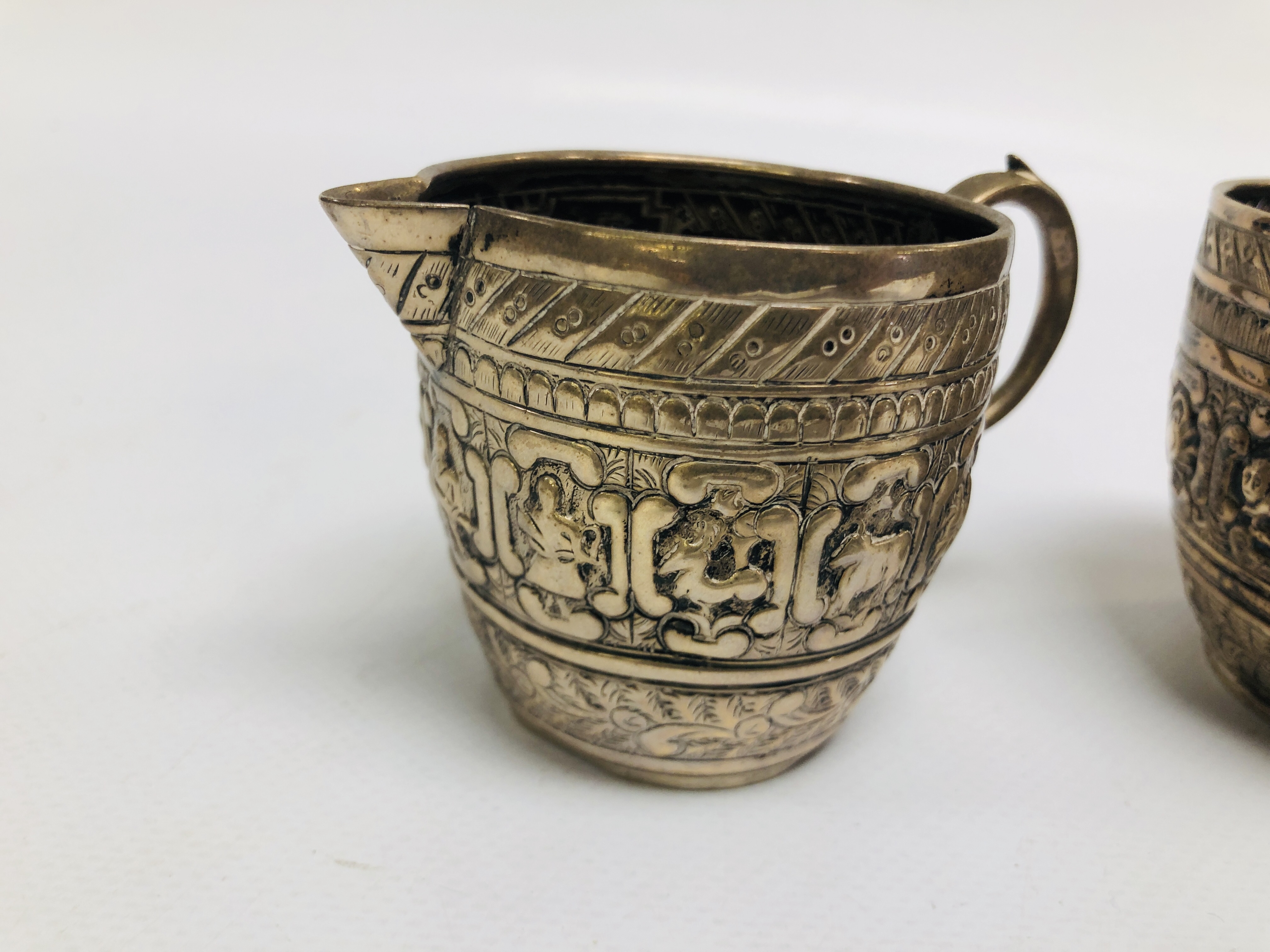 AN UNUSUAL SILVER SUGAR BOWL AND CREAM JUG EMBOSSED DECORATION DEPICTING ANIMALS, - Image 2 of 14