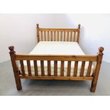 A GOOD QUALITY SOLID HONEY PINE KINGSIZE BED WITH HYPNOS "BARONET" POCKET SPRUNG MATTRESS.
