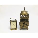 A FRENCH CARRIAGE CLOCK, THE FACE BEING PLASTIC + A MANTEL CLOCK OF LANTERN FORM.