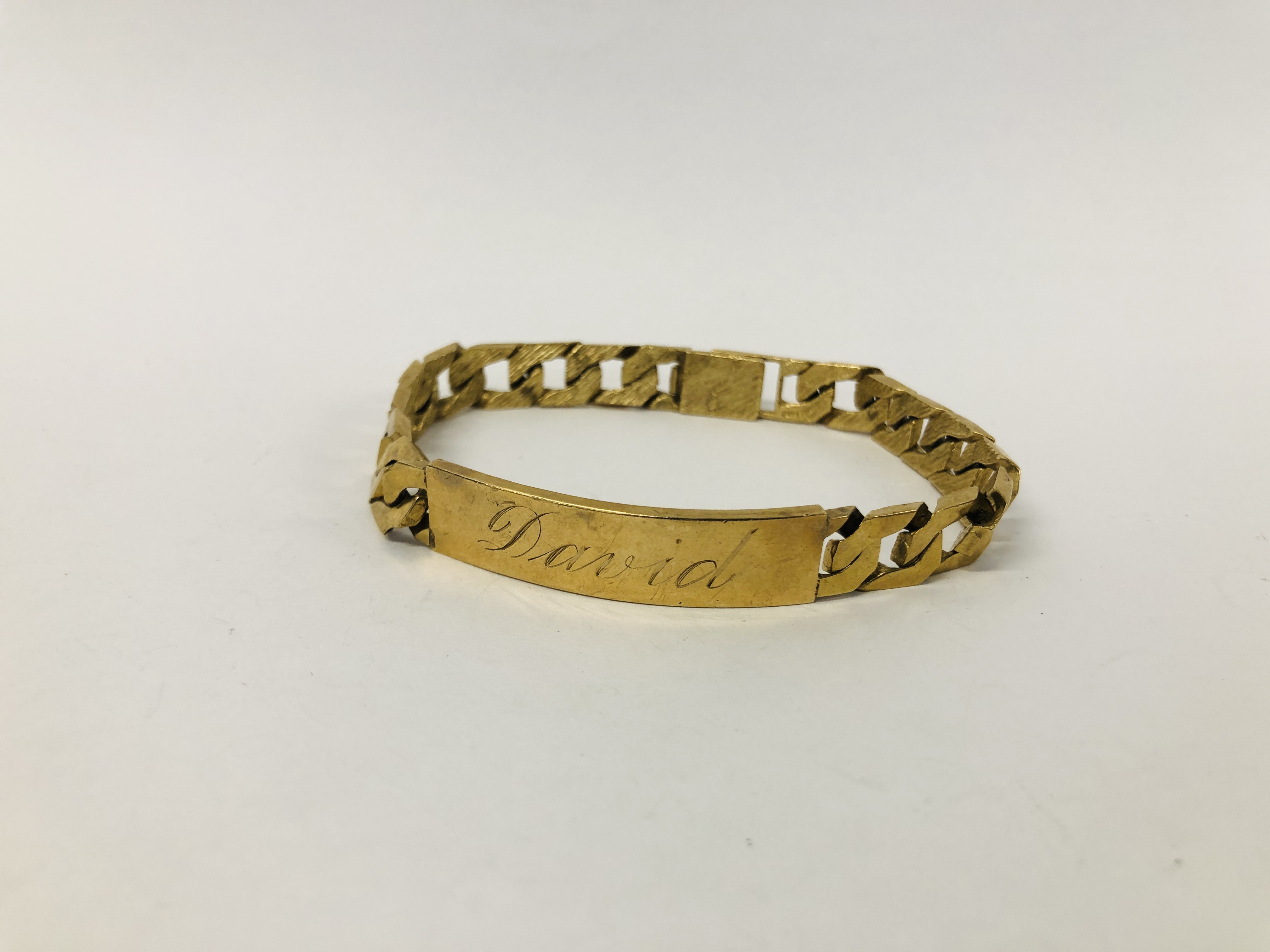 9CT. GOLD ID BRACELET INSCRIBED.