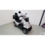 A TGA 8MPH MOBILITY SCOOTER MODEL 1106000 COMPLETE WITH TWO KEYS, CHARGER AND REAR CARRY BOX,