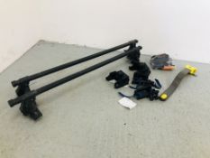 A PAIR OF THULE ROOF RACKS ALONG WITH KEYS AND VARIOUS ACCESSORIES ALONG WITH CAR STEERING WHEEL