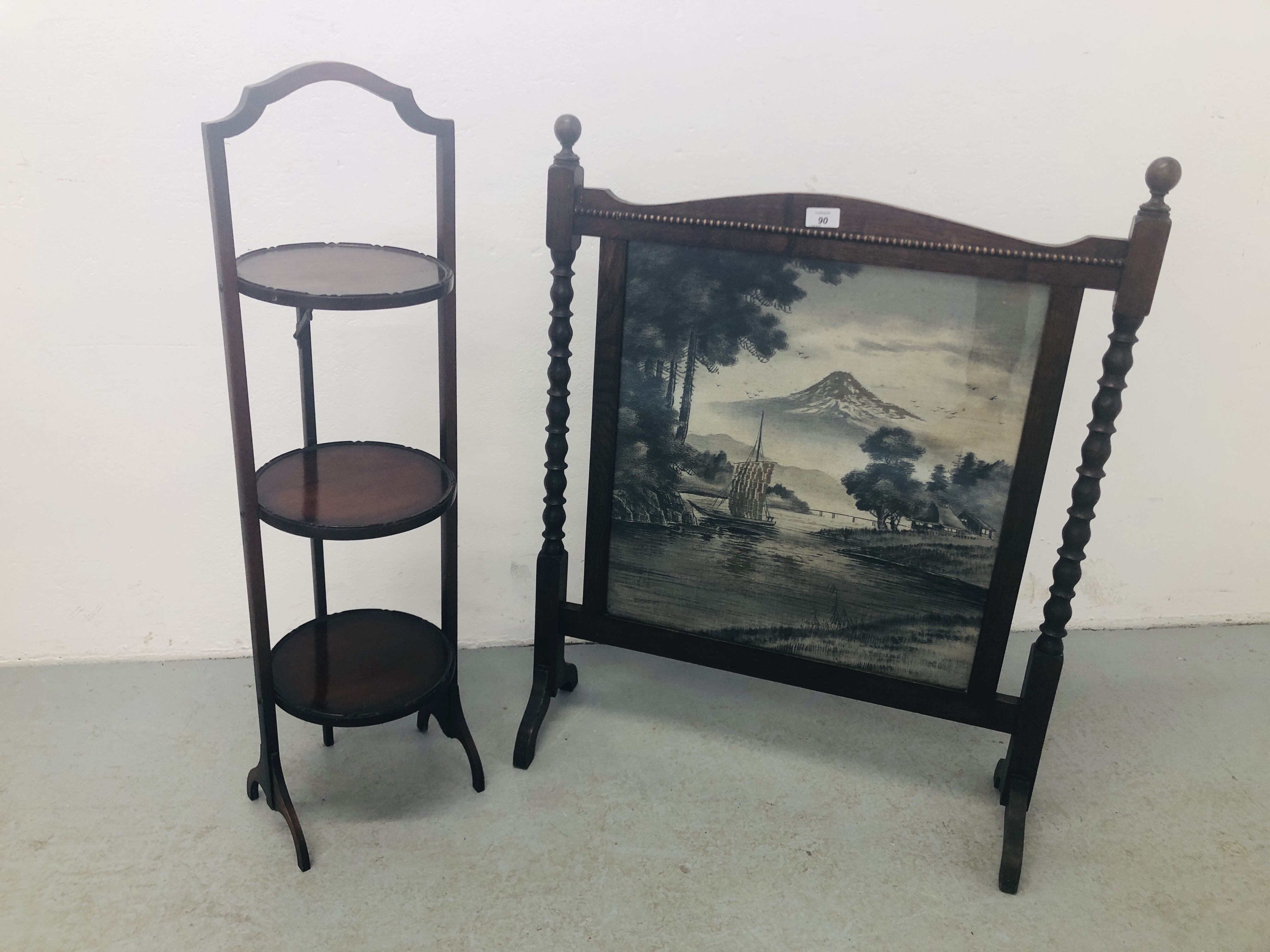 A VINTAGE STITCHWORK IN FREESTANDING BARLEY TWIST FIRE SCREEN DEPICTING BOAT ON A LAKE ALONG WITH