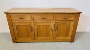 A MODERN SOLID OAK NEXT THREE DRAWER THREE DOOR SIDEBOARD WITH METAL CRAFT HANDLES 156CM X 47CM X