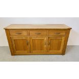 A MODERN SOLID OAK NEXT THREE DRAWER THREE DOOR SIDEBOARD WITH METAL CRAFT HANDLES 156CM X 47CM X