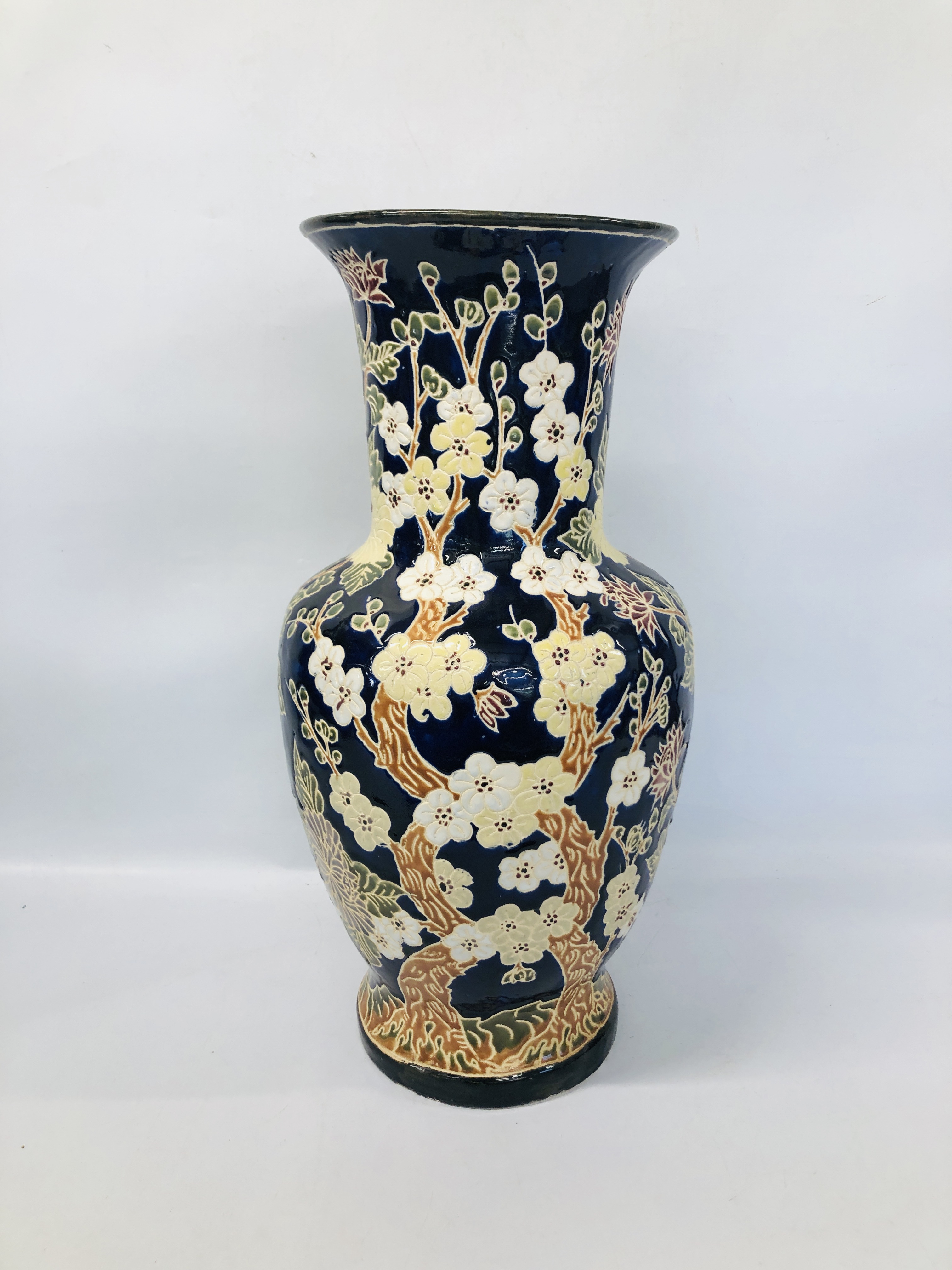 A LARGE BLUE GLAZED VASE WITH FLOWER DECORATION 63CM.