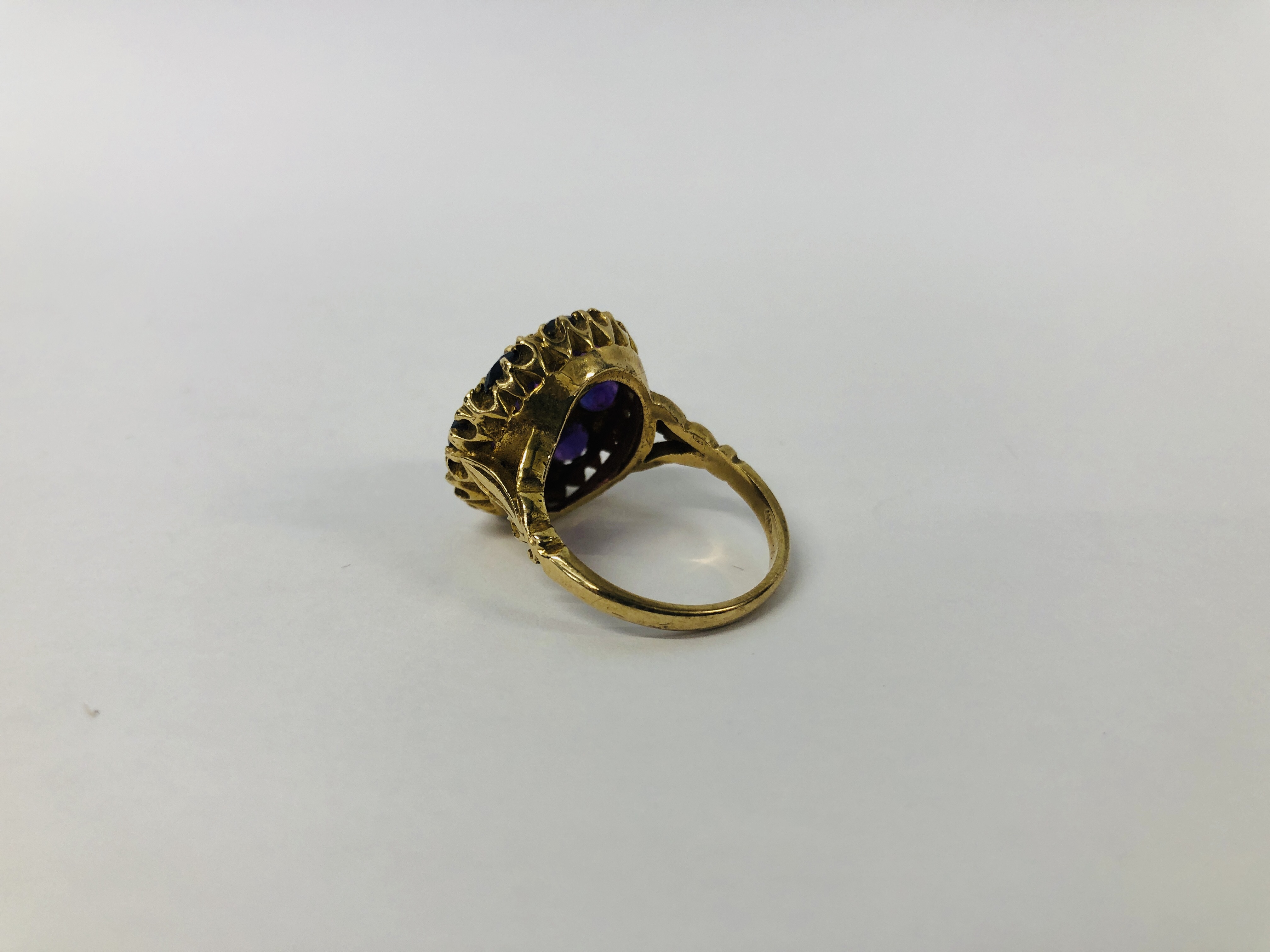 A 9CT. GOLD AMETHYST CLUSTER RING. - Image 3 of 7