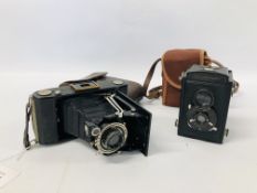 A VINTAGE ZEISS IKON FOLDING CAMERA MODEL BIIS AND VINTAGE VOIGHTLANDER BRILLIANT BOX CAMERA BOTH