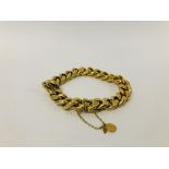 VINTAGE YELLOW METAL CURB BRACELET WITH SAFETY CHAIN (INDISTINCT MARKS).