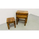 A NEST OF THREE MANGO WOOD GRADUATED TABLES.