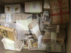 BOX OF CIGARETTE CARDS IN PENNY ALBUMS AND LOOSE, MAINLY POOR CONDITION.