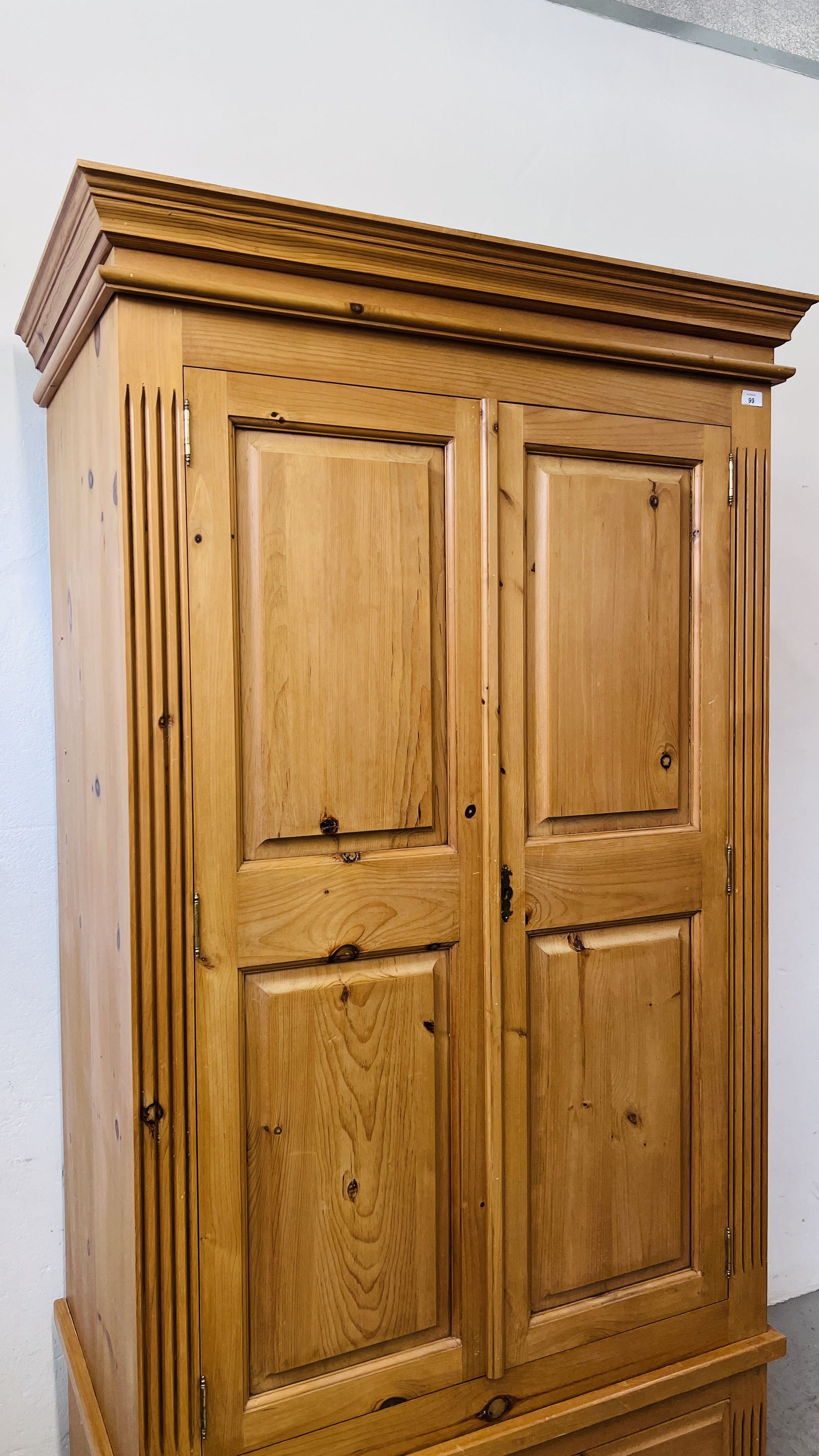 A GOOD QUALITY SOLID PINE TWO DOOR WARDROBE ON SINGLE DRAWER BASE W 102CM X D 60CM X H 194CM. - Image 5 of 8