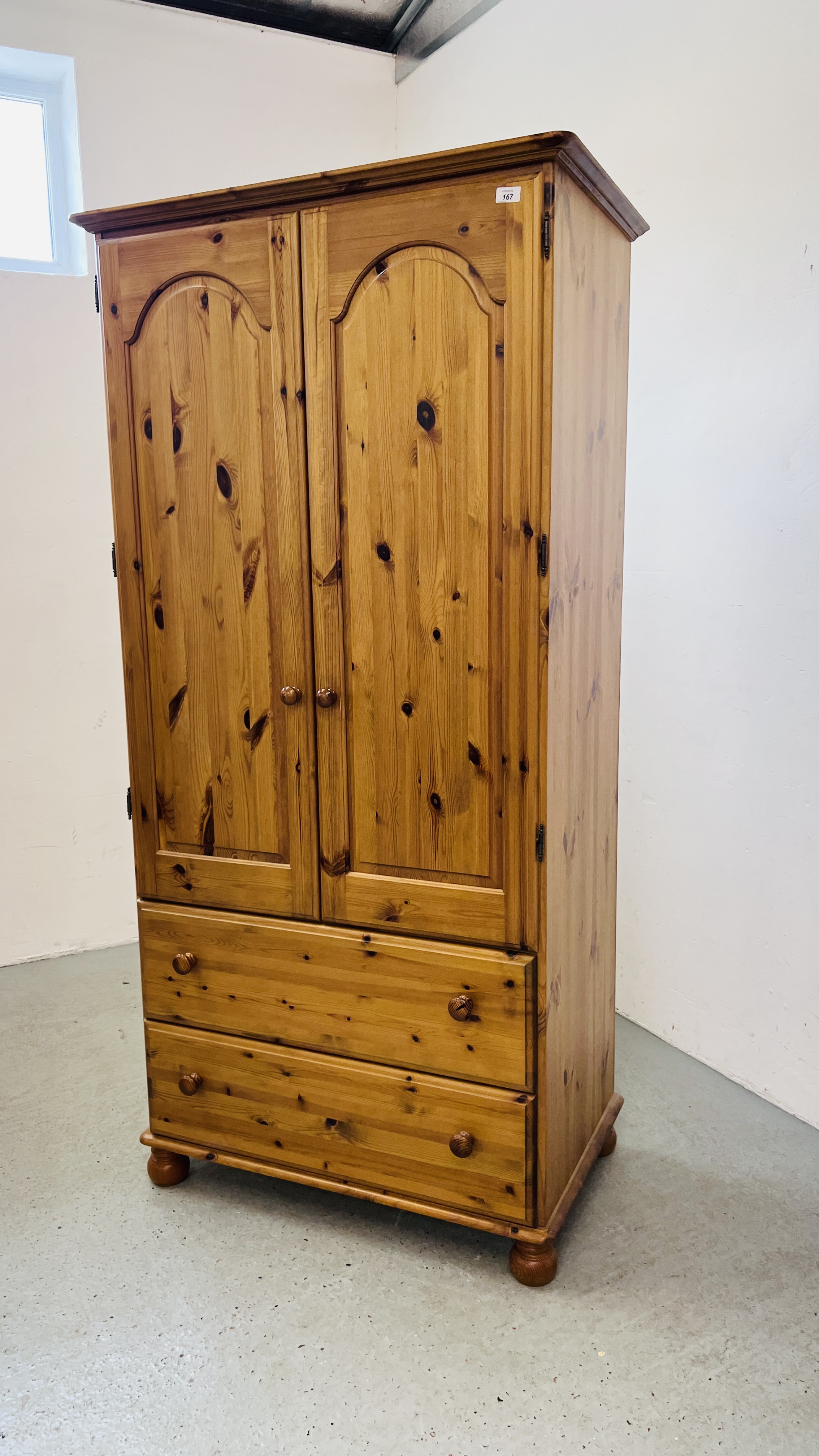 A GOOD QUALITY HONEY PINE TWO DOOR WARDROBE WITH TWO DRAWER BASE WIDTH 93CM. DEPTH 56CM.