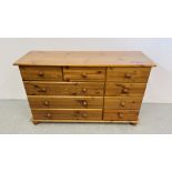 A HONEY PINE MULTI DRAWER CHEST W 120CM, D 38CM, H 74CM.