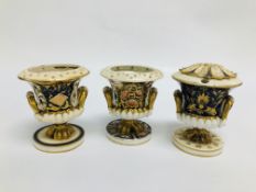 THREE VARIOUS DERBY CAMPAGNA SHAPED VASES, ONE WITH ASSOCIATED COVER (BROKEN).