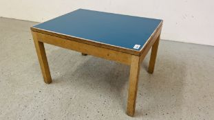 A MID CENTURY OAK FRAMED OCCASIONAL TABLE WITH BLUE TOP BEARING LABEL GORDON RUSSELL LIMITED