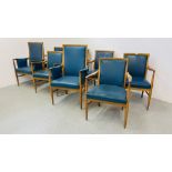 A SET OF EIGHT MID CENTURY OAK FRAMED CHAIRS WITH BLUE LEATHER UPHOLSTERED SEATS AND BACKS (2 X