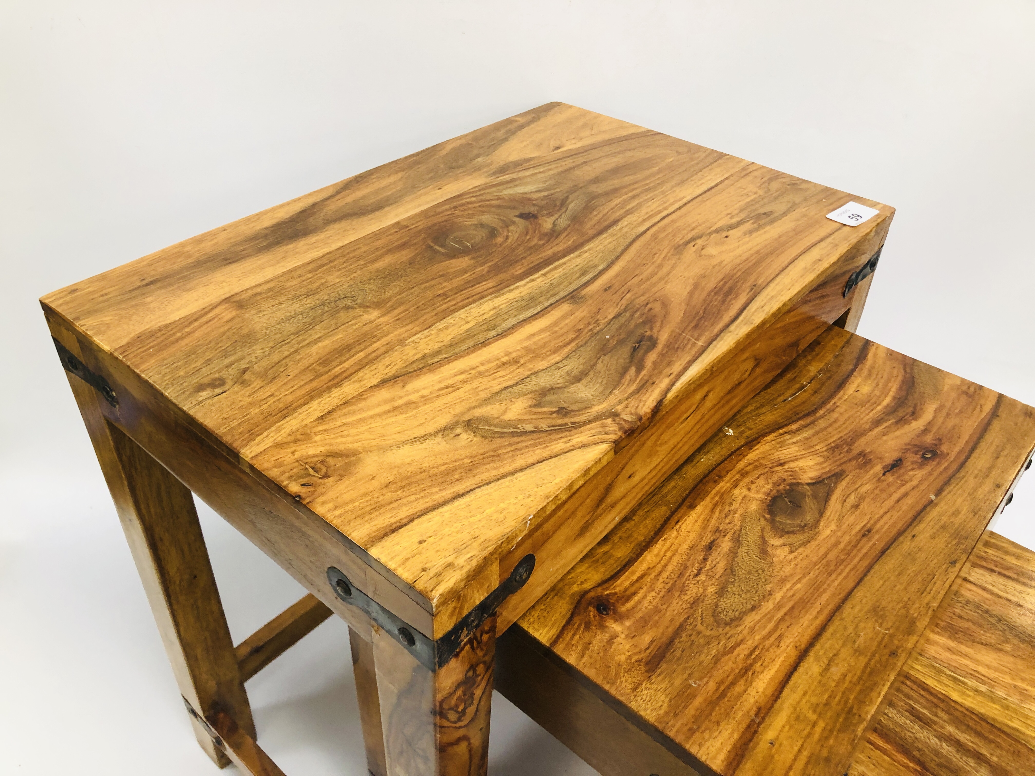 A NEST OF THREE MANGO WOOD GRADUATED TABLES. - Image 8 of 10