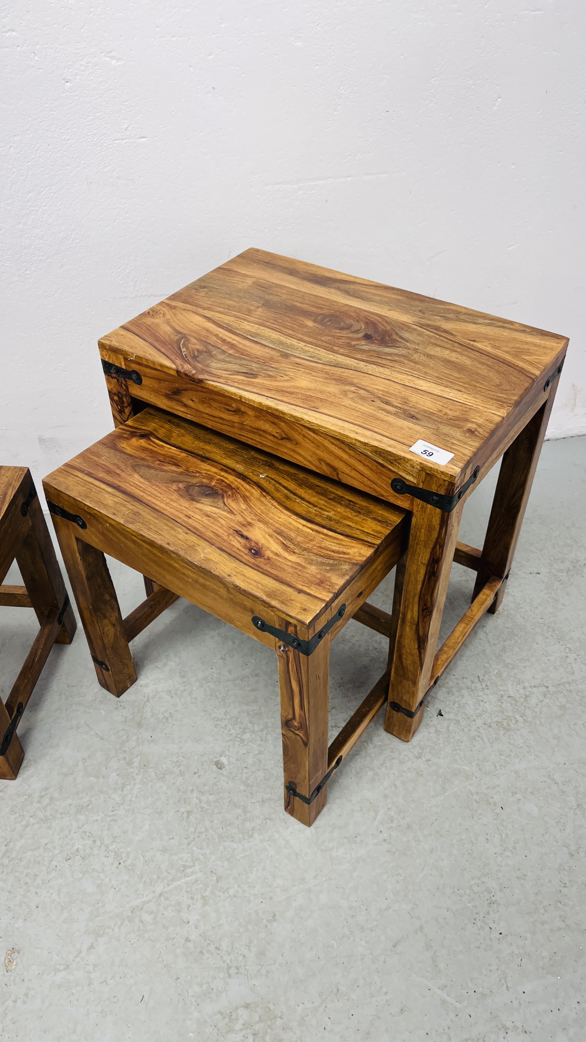 A NEST OF THREE MANGO WOOD GRADUATED TABLES. - Image 2 of 10