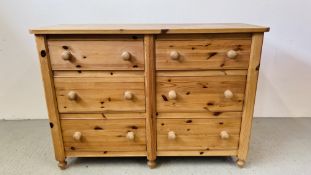 A LARGE SOLID PINE SIX DRAWER CHEST WITH TURNED KNOBS 144CM X 54CM X 101CM.