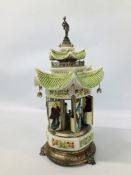 A VINTAGE PERGOLA DESIGN CERAMIC CIGARETTE DISPENSER WITH AUTOMATED MUSICAL ACTION A/F HEIGHT 45CM.