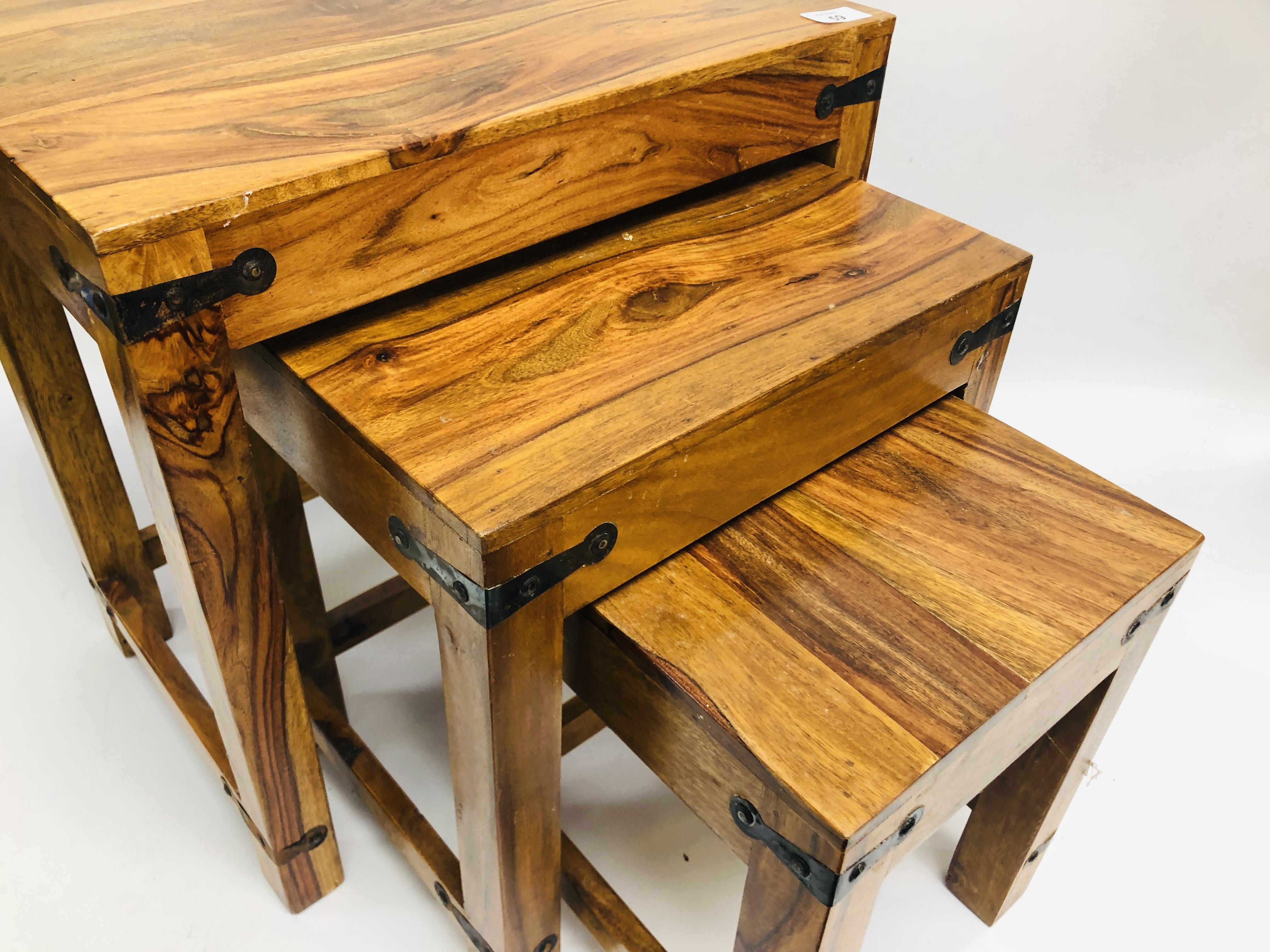 A NEST OF THREE MANGO WOOD GRADUATED TABLES. - Image 9 of 10