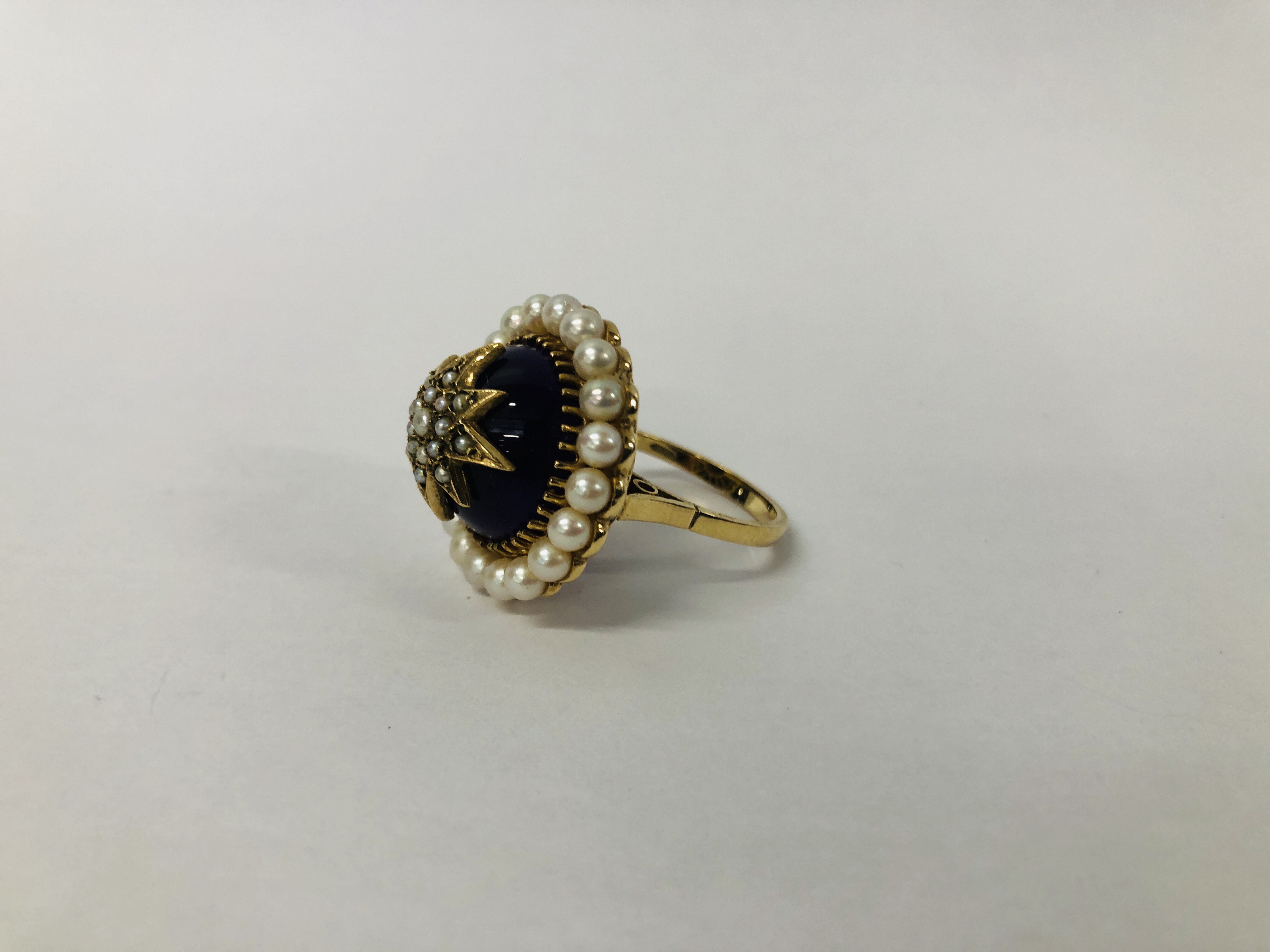 A VINTAGE VICTORIAN DESIGN 9CT. GOLD AMETHYST AND SEED PEARL RING OF RAISED FORM. - Image 3 of 10