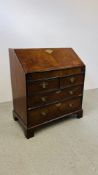 A GEORGE II WALNUT BUREAU, FALLING FRONT ENCLOSING FITTED INTERIOR WITH WELL,