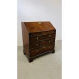 A GEORGE II WALNUT BUREAU, FALLING FRONT ENCLOSING FITTED INTERIOR WITH WELL,