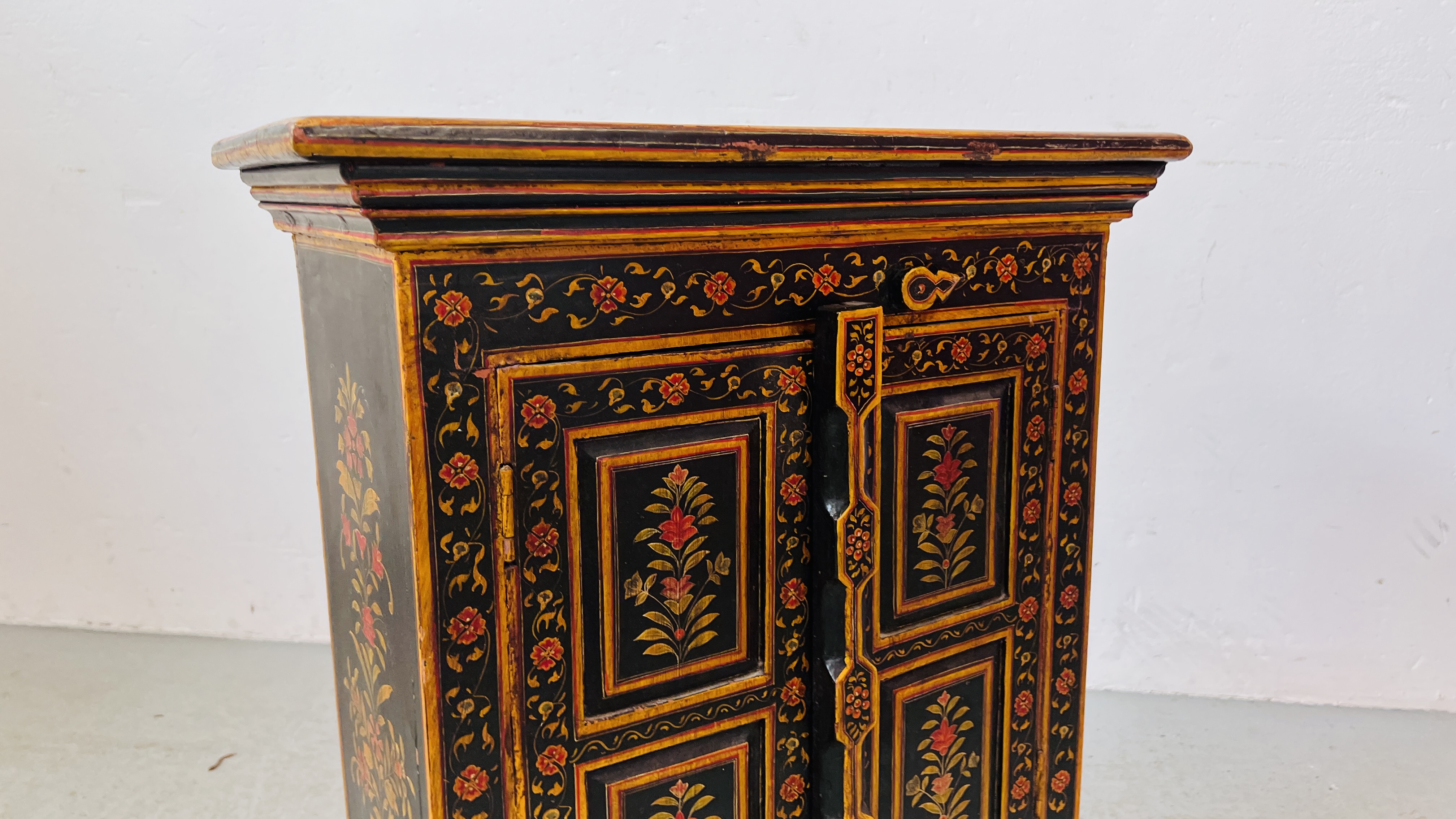 HARDWOOD EASTERN TWO DOOR TWO DRAWER CABINET WITH PAINTED CHASED AND FLOWER DECORATION, W 57CM, - Image 3 of 8