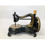 A VINTAGE HUMP BACK SEWING MACHINE COMPLETE WITH BOBBIN.